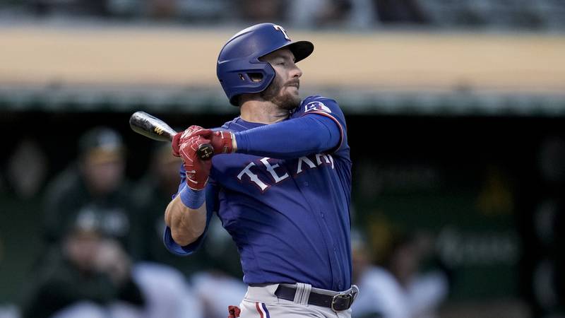 Texas Rangers' Robbie Grossman against the Oakland Athletics during the fourth inning of a...